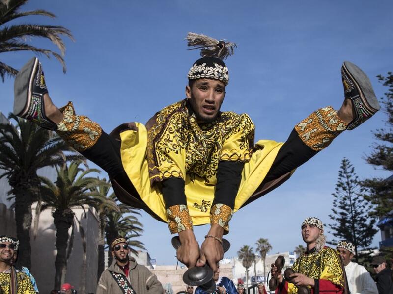 A Gnawa traditional group performs in the city of Essaouira on December 14, 2019, to celebrate the decision of adding the Gnawa culture to UNESCO's list of Intangible Cultural Heritage of Humanity. FADEL SENNA / AFP