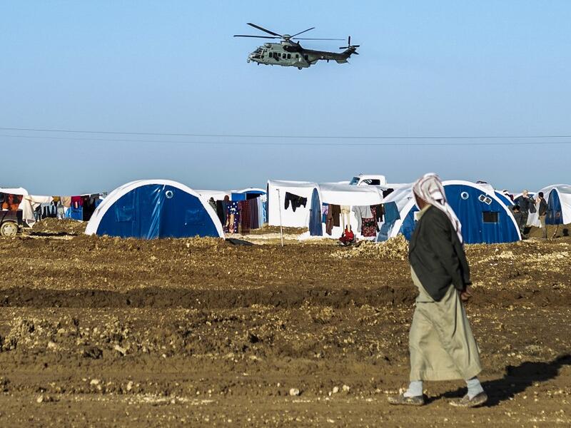  US-led military coalition in Syria over Washukanni camp which was recently established on the outskirts of Hasakeh city for people displaced from the northeastern Syrian town of Ras Al-Ain (AFP)