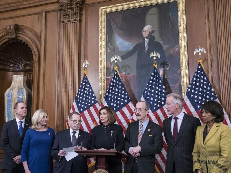 On Wednesday evening, the U.S. House of Representatives voted 230 to 197 and 229 to 198 to impeach President Trump on two articles of impeachment charging him with abuse of power and obstruction of Congress. Sarah Silbiger/Getty Images/AFP Sarah Silbiger / GETTY IMAGES NORTH AMERICA / AFP