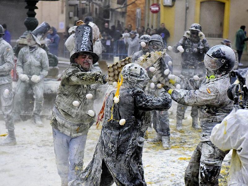 The Els Enfarinats festival takes place every year in Spain and sees two groups of residents cover each other and the entire town white with egg and flour (Twitter)