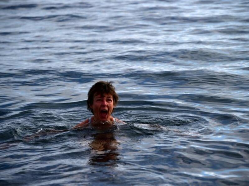 Tourists spend thousands to swim among the Penguins in Antarctica "It's like getting stabbed," a tourist exclaimed, as he plunged into the three-degree celsius water (Twitter)