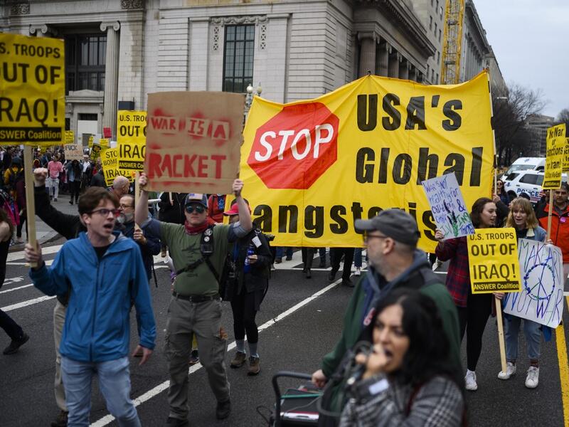 Anti-war activist march from the White House to the Trump International Hotel in Washington, DC, on January 4, 2020. ANDREW CABALLERO-REYNOLDS / AFP