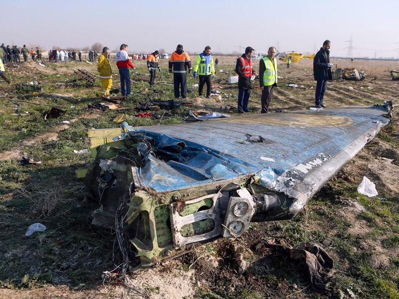  In this file photo taken on January 8, 2020 rescue teams are seen at the scene of a Ukrainian airliner that crashed shortly after take-off near Imam Khomeini airport in the Iranian capital Tehran. Iran said on January 11 that it unintentionally shot down the Ukrainian plane due to 'human error'. Akbar TAVAKOLI / IRNA / AFP