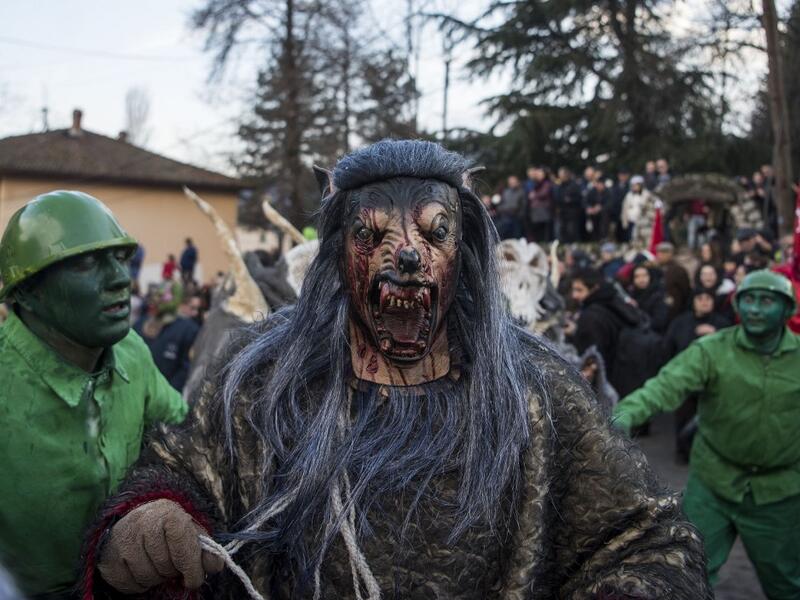Masked revellers take part in a carnival procession through the south-western North Macedonian village of Vevcani, on January 13, 2020. The Vevcani carnival is 1.400 years old and is held every year on the eve of the feast of Saint Basil (January 14), which also marks the beginning of the New Year according to the Julian calendar, observed by the Macedonian Orthodox Church. Robert ATANASOVSKI / AFP