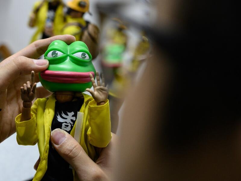 This picture taken on January 14, 2020 shows a 1:6 scale action figures depicting Pepe the Frog, a character used by pro-democracy activists as a symbol of their struggle in the Hong Kong protests, in Hong Kong. Intricately detailed Hong Kong protester figurines have become the latest must-have collectables as toy stores recreate the pro-democracy movement's street battles with police in their shop displays.  Philip FONG / AFP