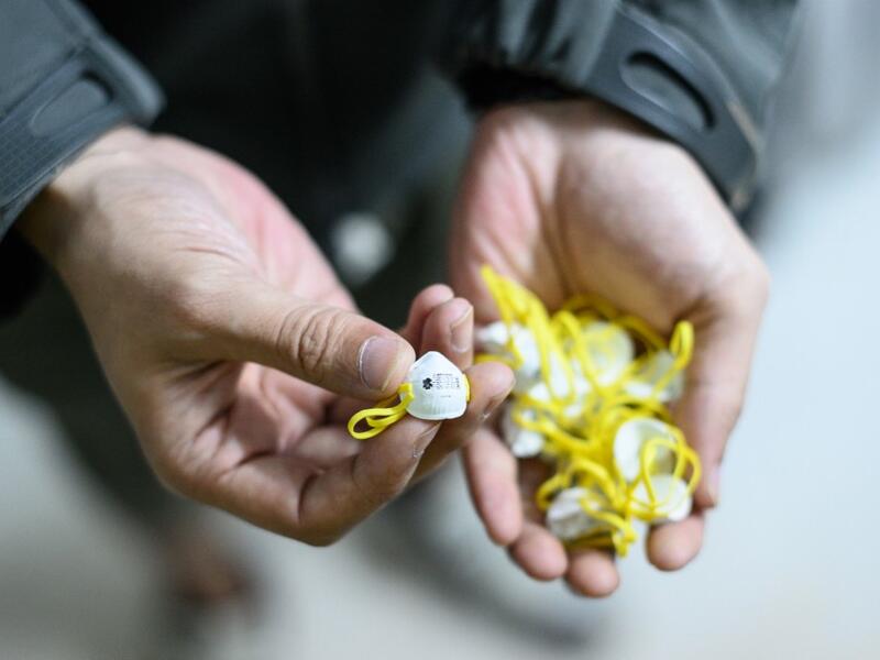 This picture taken on January 14, 2020 shows 1:6 scale face masks for action figures depicting characters involved in the Hong Kong protests, in Hong Kong. Intricately detailed Hong Kong protester figurines have become the latest must-have collectables as toy stores recreate the pro-democracy movement's street battles with police in their shop displays.  Philip FONG / AFP