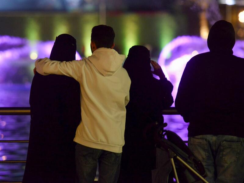 A picture taken on January 31, 2020 shows young Saudis gathering at the Riyadh Season Boulevard in the Saudi capital. In Saudi Arabia's rigid past, religious police once swooped down on rose sellers and anyone peddling red paraphernalia around Valentine's Day, but now a more open -- albeit risky -- dating culture is taking root. Pursuing relationships outside of marriage in the conservative Islamic kingdom once amounted to a death wish, and would-be Romeos resorted to pressing phone numbers up against their