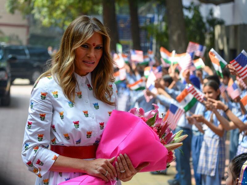 US First Lady Melania Trump holds flowers as she arrives at Sarvodaya Co-Ed Senior Secondary School, in New Delhi on February 25, 2020. US President Donald Trump moves from sightseeing and speech-making to tough trade talks in India on February 25, as First Lady Melania visits a Delhi school to witness a "happiness class". Sajjad HUSSAIN / AFP