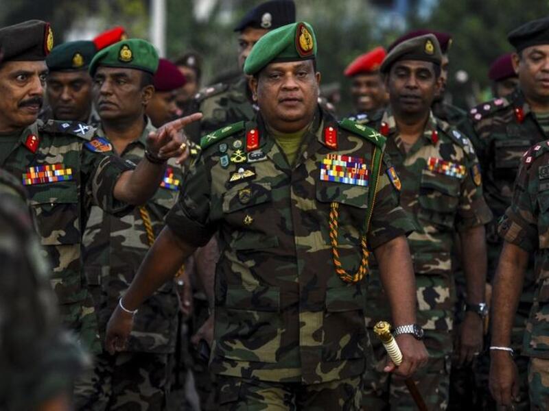 In this Jan 14, 2020, Sri Lanka's Army chief Shavendra Silva (center) arrives to supervise the military operation to revive abandoned rice paddies. (AFP)