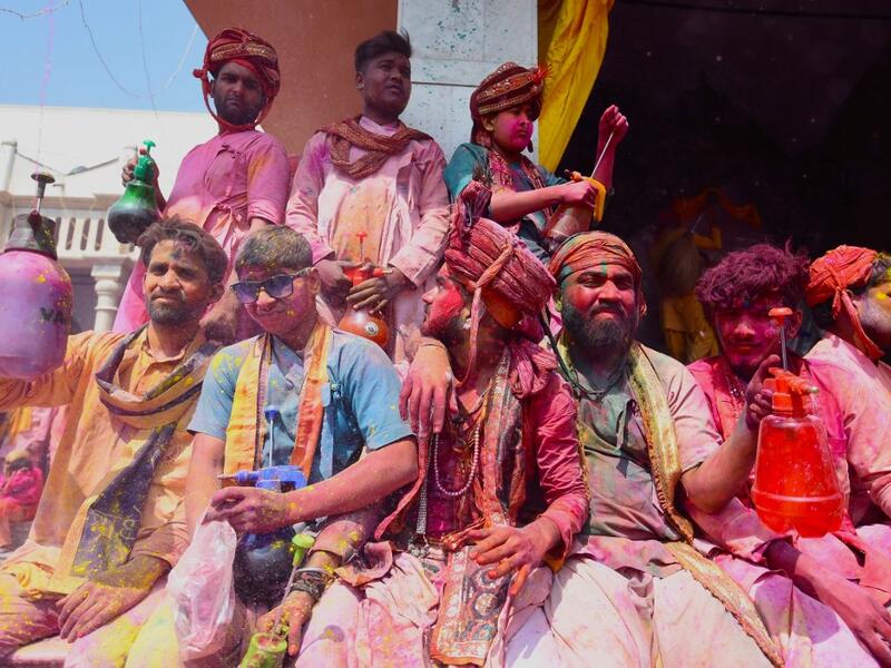 Hindu devotees celebrate Holi, the spring festival of colours, during a traditional gathering at a temple in Nandgaon village in Uttar Pradesh state on March 5, 2020. Holi is observed in India at the end of the winter season on the last full moon of the lunar month. Money SHARMA / AFP