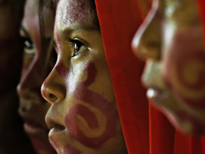 Wayuu girls prepare to perform the traditional La Yonna dance, in Tres Bocas, northern Colombia, on March 13, 2020. Juan BARRETO / AFP