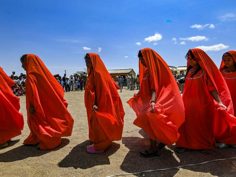 Wayuu girls perform the traditional La Yonna dance, in Tres Bocas, northern Colombia, on March 13, 2020. Juan BARRETO / AFP