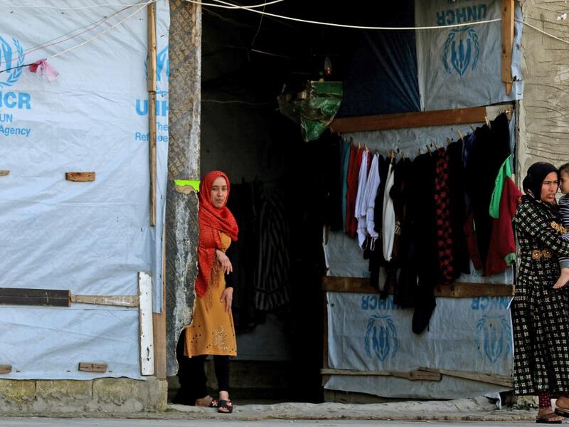 Syrian refugees are picture in a building under construction they have been using as a shelter in the city of Sidon in southern Lebanon, on March 17, 2020 amidst the coronavirus COVID-19 epidemic. AFP/File