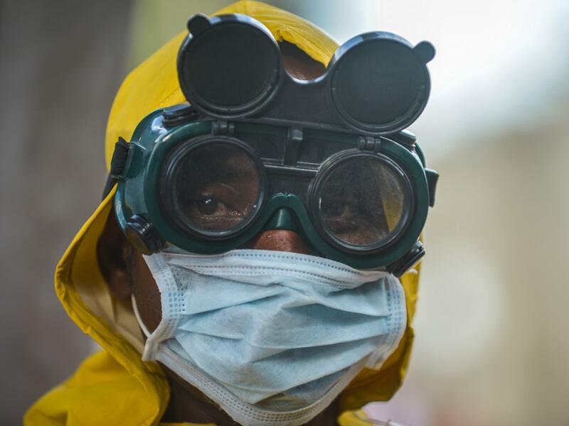 A cleaning staff waers protective gear to disinfect a metro carriage as a prevemtive measure against the spreading of the COVID-19 coronavirus in Addis Ababa, Ethiopia, on March 20, 2020. African countries have been among the last to be hit by the global COVID-19 coronavirus epidemic but as cases rise, many nations are now taking strict measures to block the deadly illness. Michael Tewelde / AFP