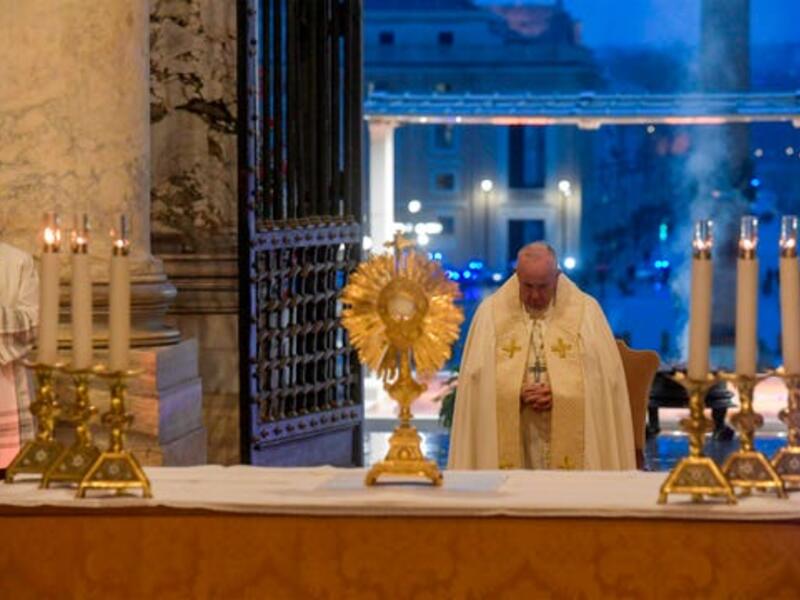 Pope Francis prepares to give the Urbi et orbi blessing after presiding over a moment of prayer on the sagrato of St Peter's Basilica, the platform at the top of the steps immediately in front of the facade of the church. (Photo: Vatican Media/AFP via Getty Images)