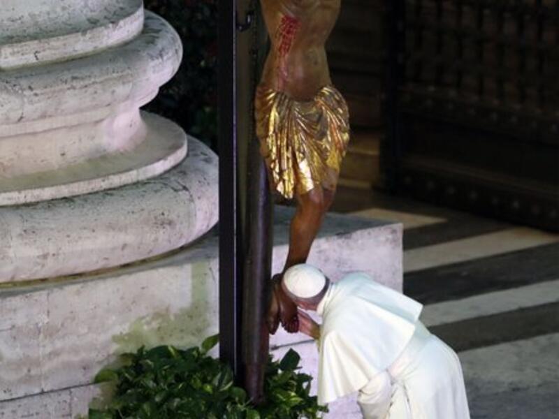 Pope Francis during a moment of prayer on the sagrato of St Peter’s Basilica, the platform at the top of the steps immediately in front of the façade of the Church, to be concluded with the Pope giving the Urbi et Orbi Blessing, on March 27, at the Vatican. YARA NARDI / AFP