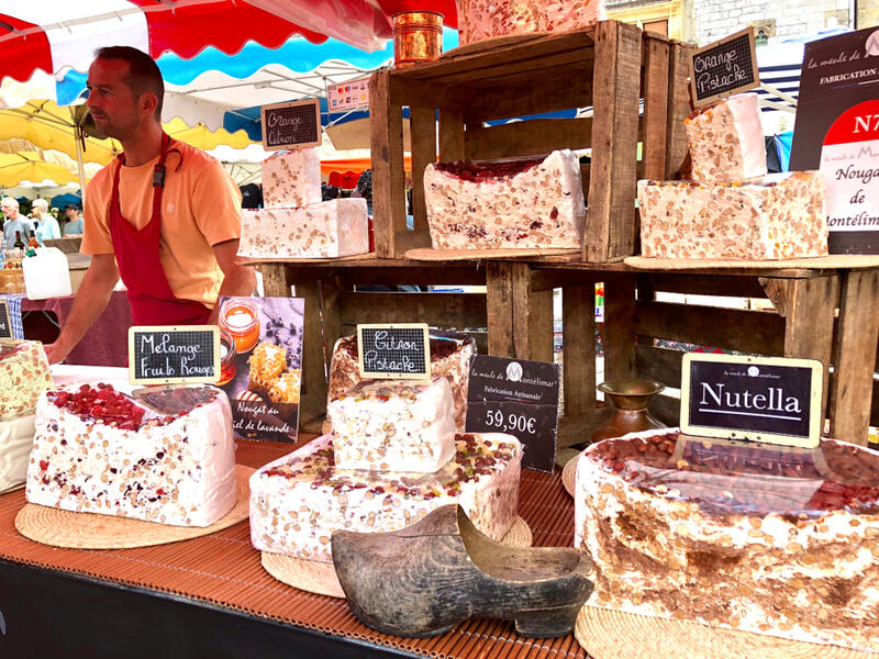 Market stall selling speciality and flavored nougat (Shutterstock) 