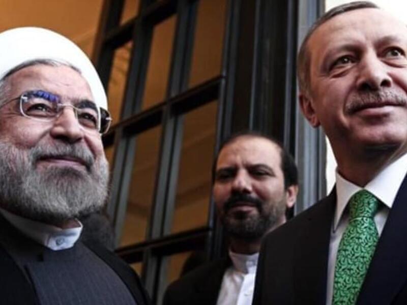 Recep Tayyip Erdogan (L) and Iranian President Hassan Rouhani. (AFP/File)