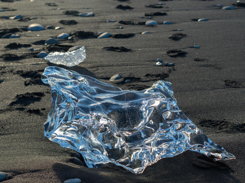 Detail of a glacial fragment of ice at Jokulsarlon glacier black beach, Iceland  (Shutterstock)