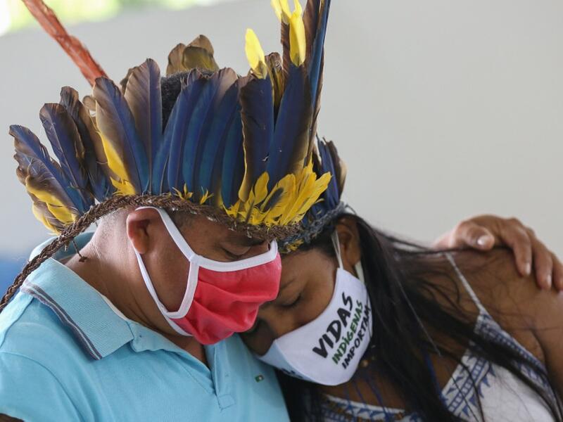 Indigenous from the Parque das Tribos community mourns at the funeral of Chief Messias, 53, of the Kokama tribe who died victim of the new coronavirus, COVID-19, in Manaus, Brazil, on May 14, 2020. MICHAEL DANTAS / AFP