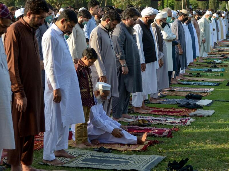 Muslims offer Eid al-Fitr prayers in Peshawar on May 24, 2020. Muslims around the world began marking a sombre Eid al-Fitr on May 24, many under coronavirus lockdown, but lax restrictions offer respite to worshippers in some countries despite fears of skyrocketing infections. Abdul MAJEED / AFP