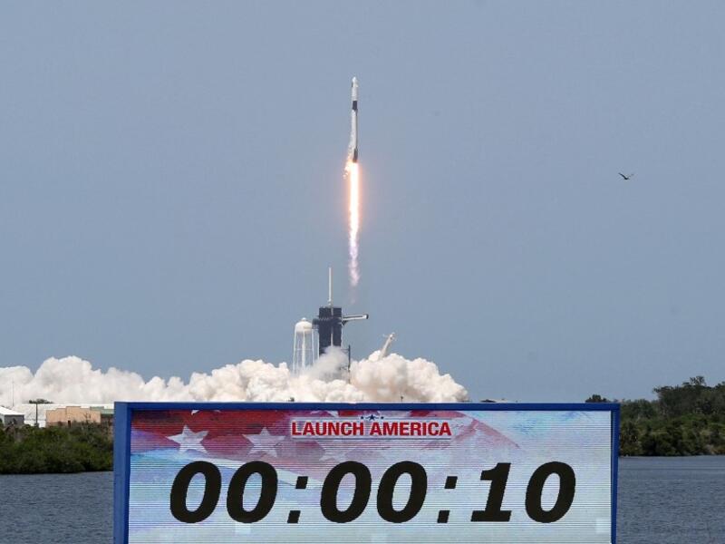 A SpaceX Falcon 9 rocket carrying the Crew Dragon spacecraft lifts off from launch complex 39A at the Kennedy Space Center in Florida on May 30, 2020. NASA astronauts Hurley and Bob Behnken are set to depart for an extended stay at the International Space Station on the SpaceX Demo-2 mission. Gregg Newton / AFP
