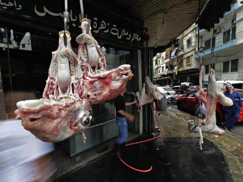 Sheep heads hang outside a butcher's shop in the Bab al-Tabbaneh neighbourhood of Lebanon's northern city of Tripoli on June 3, 2020. Thousands of residents of Lebanon's northern Tripoli struggle to put food on the table, as the country's worst economic crisis in decades has picked up in speed in recent weeks, with food prices rising by more than 70 percent since the autumn. Inflation has been a blow in the country where more than 45 percent of the country's population now lives below the poverty line, and 