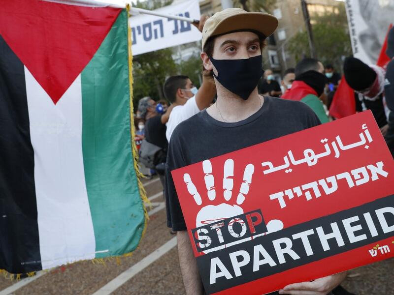 Protesters gather in Tel Aviv's Rabin Square on June 6, 2020, to denounce Israel's plan to annex parts of the occupied West Bank. Israeli Prime Minister Benjamin Netanyahu has vowed to forge ahead with annexing settlements and the Jordan Valley, in line with the peace proposals unveiled in January by US President Donald Trump. The plan has been angrily rejected by the Palestinians, who say they were not consulted on proposals they see as capitulating to Israeli demands. JACK GUEZ / AFP