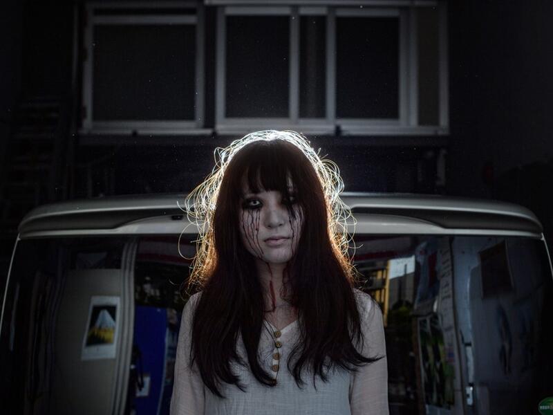 A car horn beeps and the horror begins: a bloody murder and rampaging zombies. But this drive-in haunted house in Japan protects against the most terrifying enemy of all -- coronavirus. Inside a car, guests can scream as loudly as they like, with no mask required, as hideous creatures daubed in blood swarm towards them.  Philip FONG / AFP