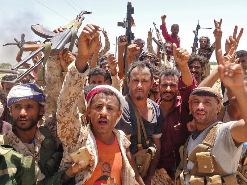 In this file photo taken on May 11, 2020, fighters from of the Southern Transitional Council (STC) gesture following clashes with Saudi-backed government forces in the Sheikh Salim area in the southern Abyan province. Nabil HASAN / AFP