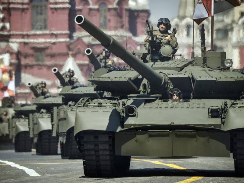 Russian T-72B3 tanks move through Red Square during a military parade, which marks the 75th anniversary of the Soviet victory over Nazi Germany in World War Two, in Moscow on June 24, 2020. The parade, usually held on May 9, was postponed this year because of the coronavirus pandemic. Alexander NEMENOV / AFP