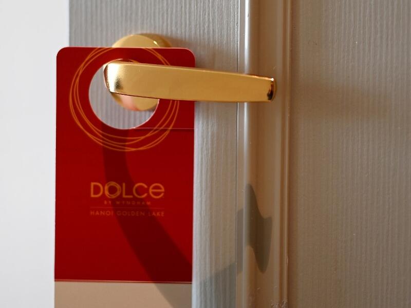 A placard hangs on a room's doorknob at the newly-inaugurated Dolce Hanoi Golden Lake hotel, the world's first gold-plated hotel, in Hanoi on July 2, 2020. Manan VATSYAYANA / AFP