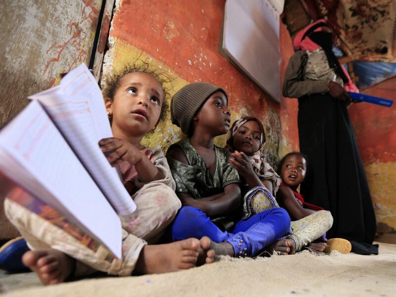 Children of Yemen's minority group known as "Muhamasheen" -- literally the "Marginalised" attend a lesson at a slum in the capital Sanaa on July 4, 2020. At a time when the Black Lives Matter movement is reshaping societies, black Yemenis have scant hope for an end to centuries of discrimination that has only worsened during the civil war. In Sanaa, members of the minority group known as "Muhamasheen" live in dismal conditions in densely populated slums. They count among the poorest of the poor in the Arab 