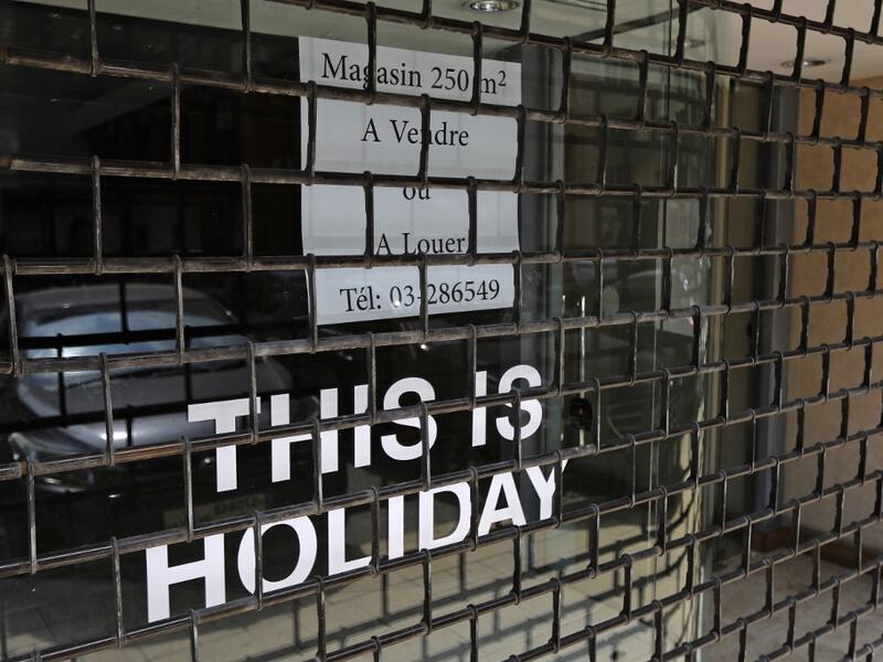 A closed shop for rent or sale in the upmarket area of Kaslik, north of Lebanon's capital Beirut, is pictured on July 16, 2020. The International Monetary Fund warned of the high cost of holding up reforms in Lebanon, two months into bailout talks to redress its nosediving economy. JOSEPH EID / AFP