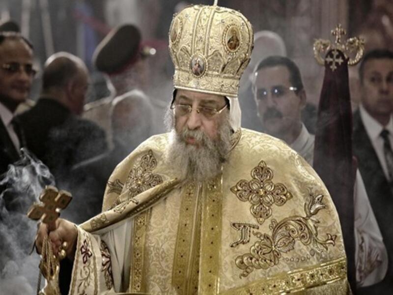 Coptic Pope Tawadros II leads prayers during the Easter Eve service at St. Mark's Cathedral in Cairo - AFP