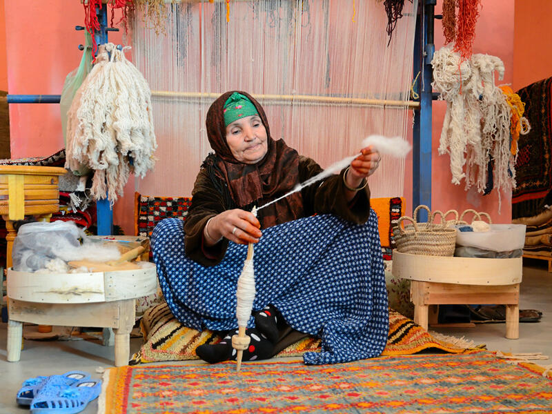 Woman spining a woolen string for berber. (Shutterstock/ File Photo)