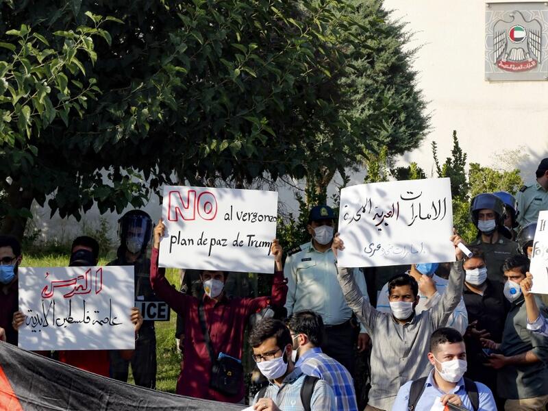 Iranian students hold banners during a protest against a US-brokered deal between Israel and the UAE to normalise relations, in front of the UAE embassy in the capital Tehran, on August 15 2020. AFP