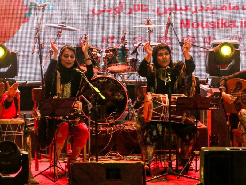 Members of the Iranian all-women music band "Dingo" (L to R) Malihe Shahinzadeh, Negin Heydari, Faezeh Mohseni, and Noushin Yousefzadeh perform together at a concert during the state-organised "Persian Gulf music" festival at Avini Hall in Iran's southern Gulf port city of Bandar Abbas on April 29, 2019. ATTA KENARE / AFP