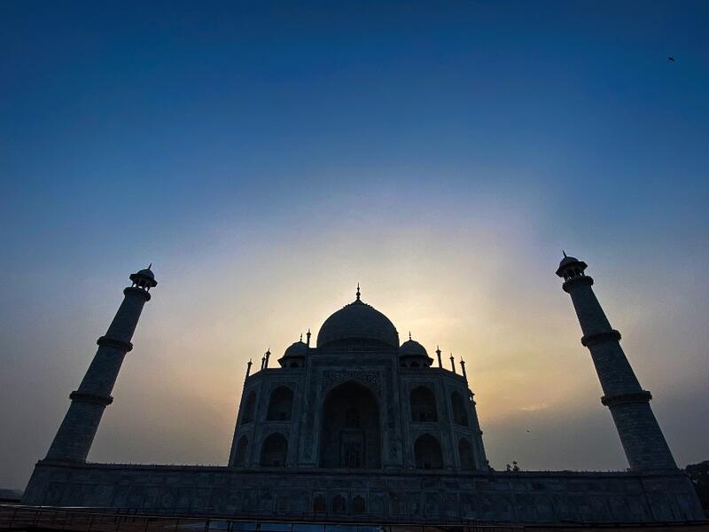 The sun rises behind the Taj Mahal in Agra on September 21, 2020. The Taj Mahal reopened to visitors on September 21 in a symbolic business-as-usual gesture even as India looks set to overtake the US as the global leader in coronavirus infections. Sajjad HUSSAIN / AFP