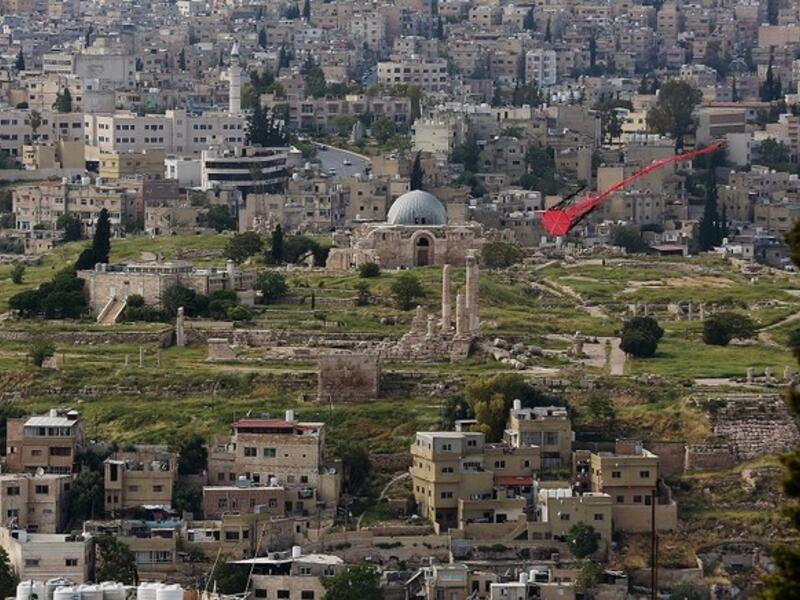 A picture taken on April 27, 2020, shows a kite flying over the Jordanian capital Amman, with the Amman Citadel in the background. (File/AFP)