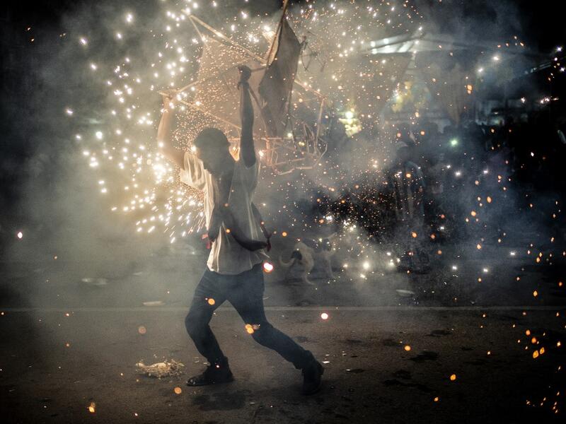 A member of the Afro-Mexican community carries a "toritol" of fire in the annual festival dedicated to San Nicolas Tolentino, in Cuajinicuilapa, Guerrero state, Mexico, on September 9, 2020, amid the COVID-19 coronavirus pandemic. Although there are 1,5 million African descendants in a country of 128 million inhabitants, it is normal to hear that "in Mexico there are no blacks". PEDRO PARDO / AFP