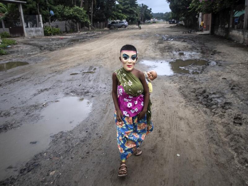 A boy, member of the Afro-Mexican community and disguised as "La Minga", walks before performing Los Diablos dance, at El Pitayo community in Cuajinicuilapa, Guerrero state, Mexico, on September 10, 2020, amid the COVID-19 coronavirus pandemic. Although there are 1,5 million African descendants in a country of 128 million inhabitants, it is normal to hear that "in Mexico there are no blacks". PEDRO PARDO / AFP