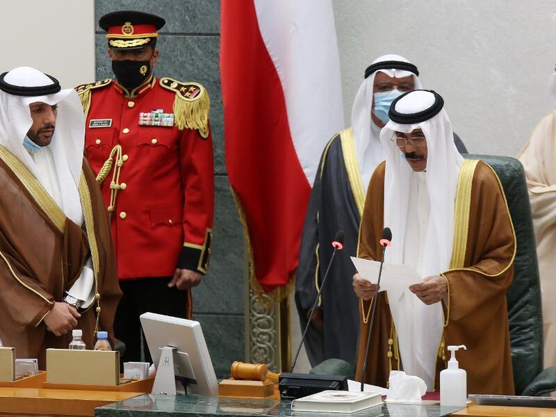 Sheikh Nawaf al-Ahmad Al-Sabah (2-R) reads a statement asfter being sworn in as Kuwait's new Emir at the National Assembly in Kuwait City, as Parilament Speaker Marzouq al-Ghanem (L) looks on, on September 30, 2020. Kuwait today swore in its new emir, Sheikh Nawaf al-Ahmad Al-Sabah, after the death of his half-brother, Sheikh Sabah, who died in the US at the age of 91. Yasser Al-Zayyat / AFP