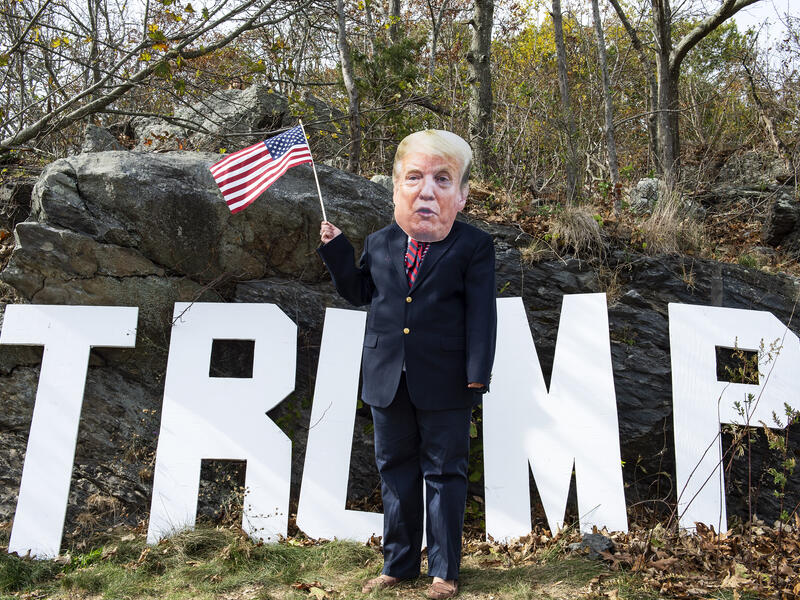 A contestant dressed as President Trump participates in a Trump campaign rally named "Trumptoberfest" at Rocky Point Park in Warwick, Rhode Island on October 11, 2020. Many supporters dressed in political campaign clothing and waved flags while others dressed in festive costumes to take part in a political costume contest. Joseph Prezioso / AFP