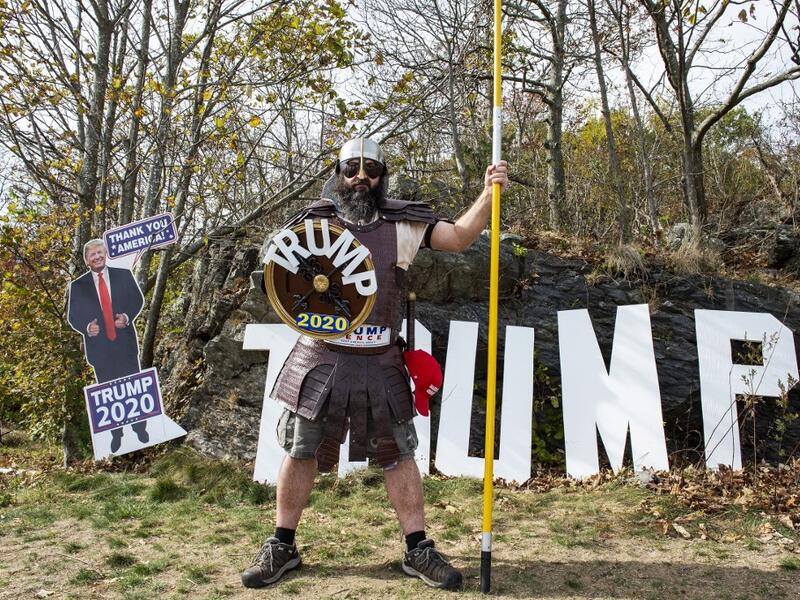 A contestant dressed as a viking version of President Trump poses for a portrait during a Trump campaign rally named "Trumptoberfest" at Rocky Point Park in Warwick, Rhode Island on October 11, 2020. Many supporters dressed in political campaign clothing and waved flags while others dressed in festive costumes to take part in a political costume contest. Joseph Prezioso / AFP