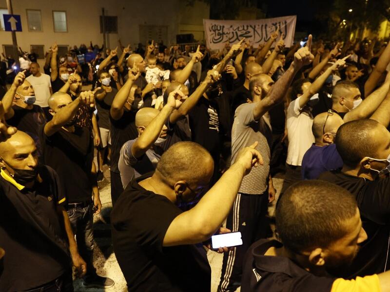Arab-Israeli protesters gather outside the residence of the French Ambassador to Israel, in Tel Aviv on October 24, 2020, in response to comments by French President Emmanuel Macron defending cartoons of the Prophet Mohammed. JACK GUEZ / AFP