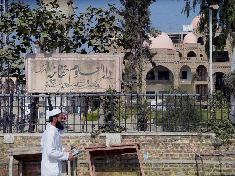 In this picture taken on October 19, 2020 an Islamic seminary student walks outside the Darul Uloom Haqqania seminary in Akora Khattak. The Darul Uloom Haqqania seminary has churned out a who's who of Taliban top brass -- including many now on the hardline group's negotiating team holding talks with the Kabul government to end a 20-year war. Abdul MAJEED / AFP