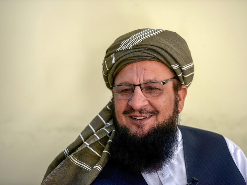 In this picture taken on October 19, 2020 spokesman of religious political pary, Jamiat Ulema Islam-Sami (JUI-S), Maulana Yousaf Shah speaks during an interview with AFP at the Darul Uloom Haqqania seminary in Akora Khattak. Shah cracks a wide smile as he rattles off a list of former students turned Taliban leaders, revelling in their victories over superpowers on Afghanistan's battlefields after graduating from Pakistan's "university of jihad". 