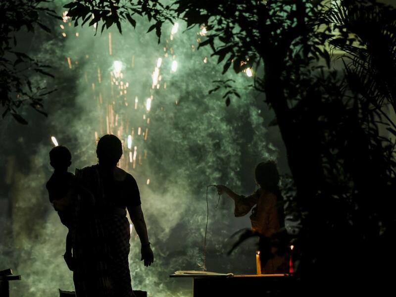 People light firecrackers during Diwali, the Hindu Festival of Lights, in Chennai on November 14, 2020. Arun SANKAR / AFP