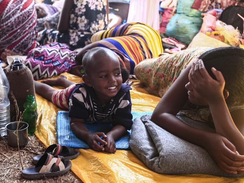 Ethiopian refugee children who fled fighting in Tigray province, lay in a hut at the Um Raquba camp in Sudan's eastern Gedaref province, on November 16, 2020. Sudan -- one of the world's poorest countries, now faced with the massive influx -- has reopened the camp, 80 kilometres (50 miles) from the border. It once housed refugees who fled Ethiopia's 1983-85 famine that killed over a million people. Ebrahim HAMID / AFP